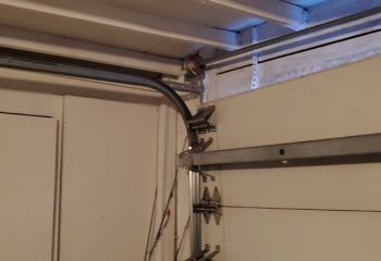 Garage door cable repair service in Kearny NJ showing cable replacement and maintenance work