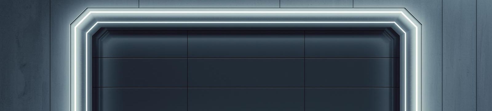 Modern dark gray garage door with LED accent lighting showcasing 2025's latest smart garage door technology for Belleville NJ homes