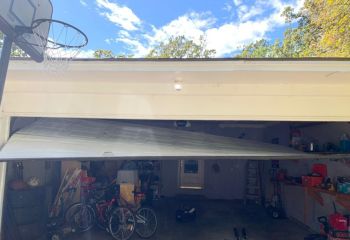 Garage door stuck off tracks inside Nutley NJ home before professional repair