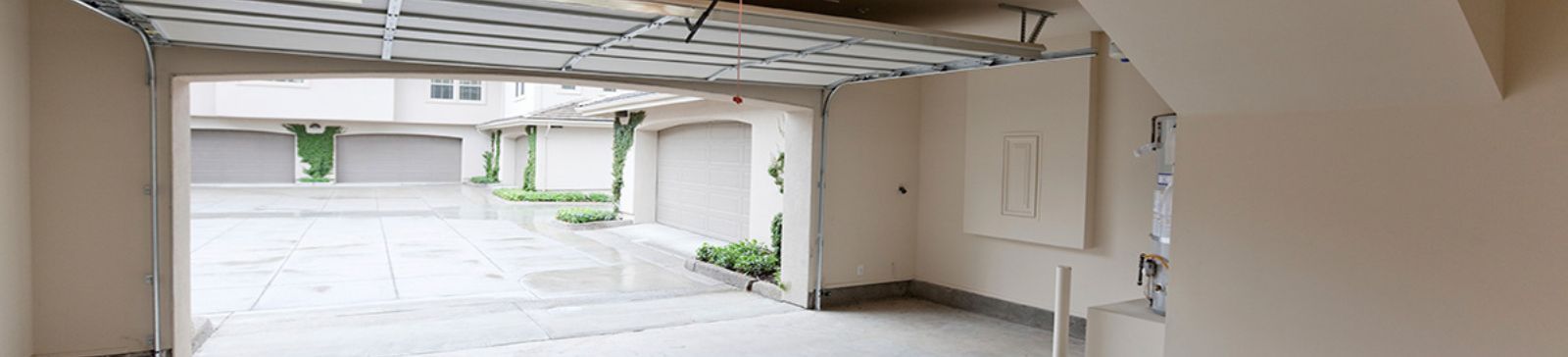 Clean and quiet residential garage with new sectional doors installed by Belleville experts