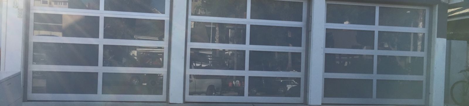 Sleek glass panel garage doors after installation in Belleville NJ